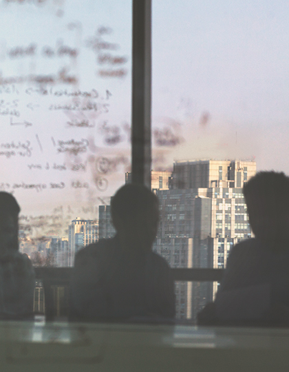 Silhouette of people in a conference room
